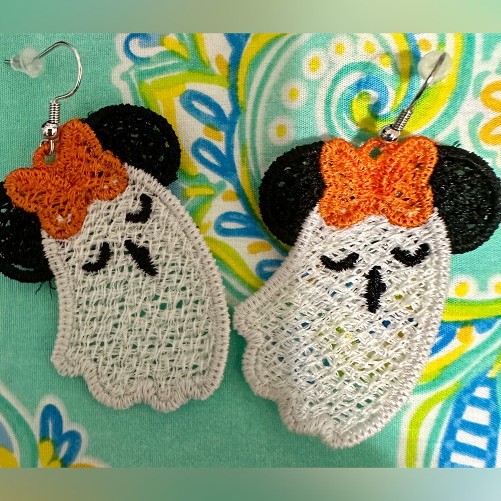 Embroidered FSL Light weight flowing Ghost earrings with a bow and ears.